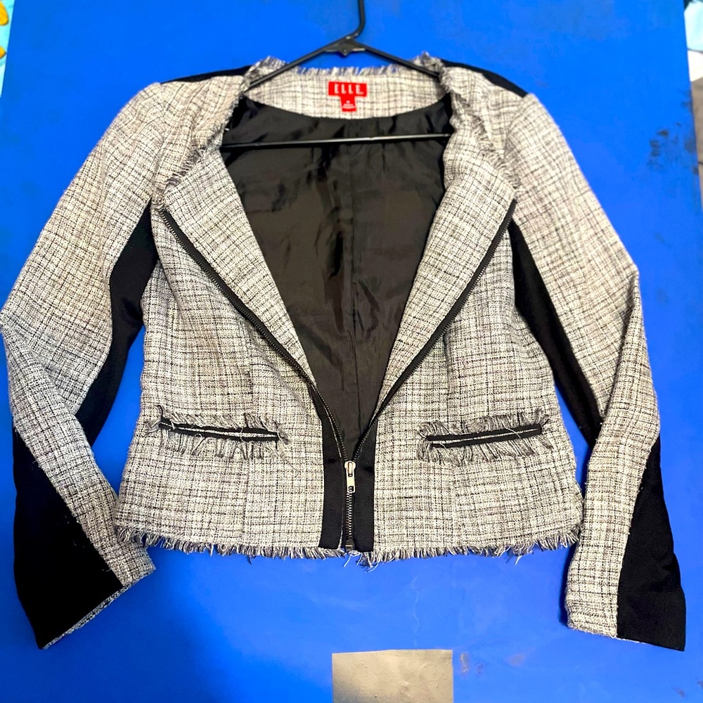 Various sizes of women’s and some boys lightweight coats , jackets and some tops